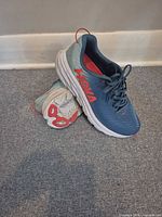 Pair of shoes angled, showing lateral side, outsole wear and dirt visible