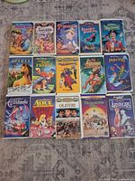 All fifteen VHS tapes laid out showing cover art