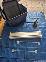 All items laid out: tote, shelf, bell, two towel bars