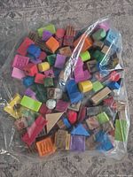 Bag of assorted wooden and plastic educational blocks