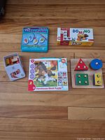 All five preschool toys laid out together on floor