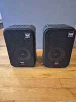 Front view of both Pyramid 5080 speakers with grilles and badges