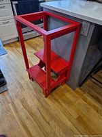Front quarter view showing full step stool and red paint