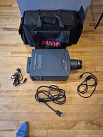 Projector, power cord, VGA cable and carry bag overview