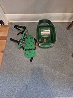 Spreader and one aerator sandal on carpet