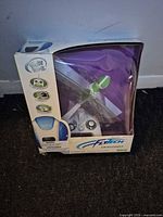 Front of retail box showing Dragonfly toy, controller visible in window