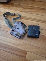 Rangefinder front with camo case and strap