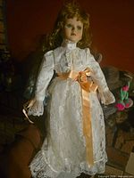 Full view of doll showing dress and overall condition