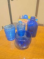all four cobalt blue glass items together