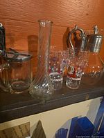 Group shot of assorted glassware on shelf