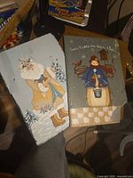 Both wooden plaques side by side showing overall designs