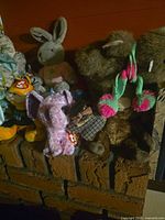 Group of Ty plush toys on brick surface