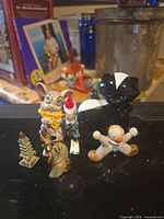 Front view of six assorted ceramic figurines
