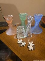 Full lot showing three frosted candle holders, crystal angel, pressed glass dish and two dove napkin rings