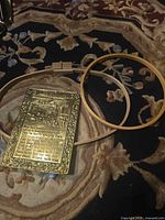 Plaque and both hoops for size reference