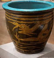 Front view showing dragon motif and turquoise interior