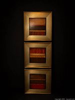 Front view of one framed abstract print showing three square panels