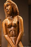 close-up of mermaid upper body showing carving detail
