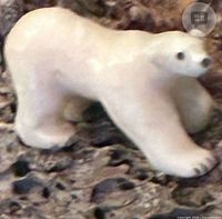 Close-up of one ivory polar bear on base