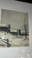 Full view of framed painting showing winter farm scene and signature