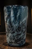 Front view of cylindrical smoky marbled art glass vase