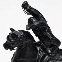 Left side close-up showing rider and lasso detail