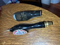 Both beer tap handles side by side on tabletop