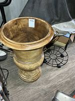 Tan glazed clay pedestal urn showing interior and exterior surface