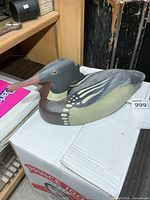 Left front view of carved merganser decoy