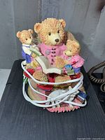 Front view of resin bear family night light showing figures, book, cord