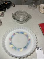 Overall view showing both casserole with lid and quiche dish