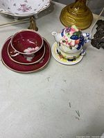 Schwarzenhammer trio stacked with mini teapot set adjacent on table