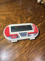 Front view of Nintendo Boxing BX-301 handheld game on wooden surface