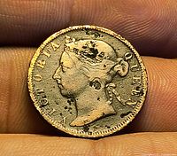 Obverse showing Queen Victoria portrait with wear and pitting