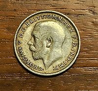 Obverse showing King George V left-facing bust and inscription GEORGIVS V D G BRITT OMN REX F D IND IMP