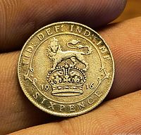 Reverse side with crowned lion, denomination SIXPENCE and date 1916