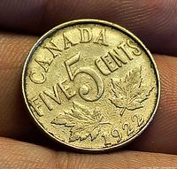 Reverse side of 1922 Canada 5 cent coin showing denomination and date
