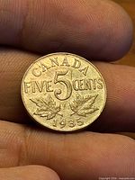 Obverse showing CANADA FIVE CENTS, maple leaves and 1935 date