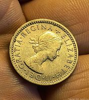 Obverse of 1960 UK sixpence coin featuring Queen Elizabeth II portrait and legend