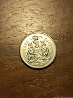 Coin obverse displaying CANADA 1974 50 CENTS and Coat of Arms