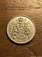 Reverse showing Canadian Coat of Arms and date 1976 on 50 cent coin