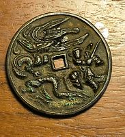 Obverse side with dragon, warrior, serpent motifs