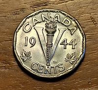 Reverse showing torch, V, date 1944, maple leaves