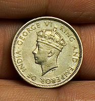 Obverse showing crowned portrait of King George VI with legend