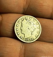 Obverse showing Liberty bust, stars, date 1902