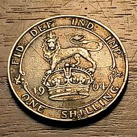 Reverse of 1904 one shilling coin showing crowned lion and date
