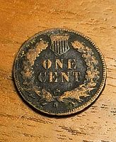 Reverse of 1908 Indian Head Cent showing ONE CENT legend, shield and wreath