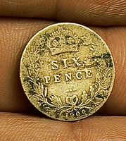 Reverse of coin showing date 1909 and crowned denomination