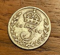 Reverse view showing crowned numeral 3, wreath and date 1914