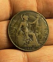 Reverse of 1918 penny showing Britannia, date, and toning